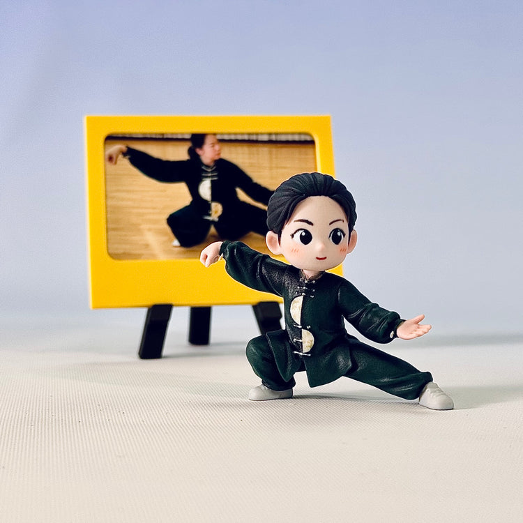 Finished green custom Tai Chi figure in a low lateral stance beside a yellow simple photo frame
