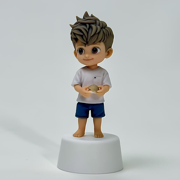 Close finished view of the barefoot child custom figure holding a seashell
