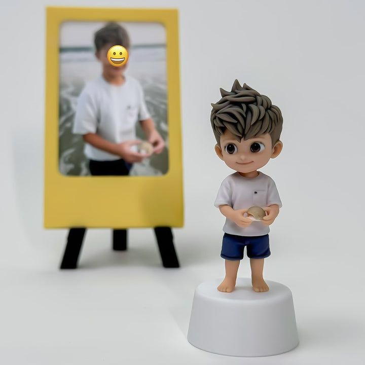 Finished child custom figure holding a seashell beside a simple yellow photo frame